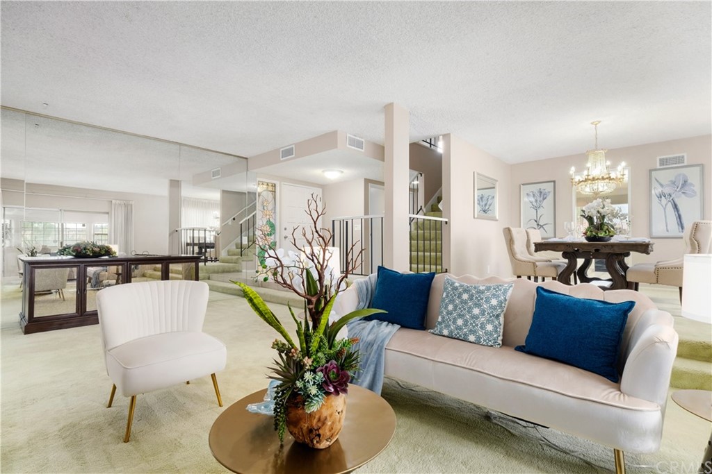 1497 Sunshine Drive Glendale, CA 91208 - Photo 12 of 52 a living room with furniture and a dining table with kitchen view