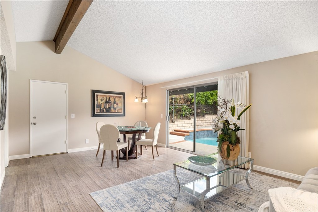 1497 Sunshine Drive Glendale, CA 91208 - Photo 23 of 52 a living room with furniture a dining table and a potted plant