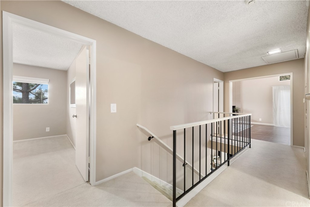 1497 Sunshine Drive Glendale, CA 91208 - Photo 27 of 52 a view of a hallway with windows and stairs