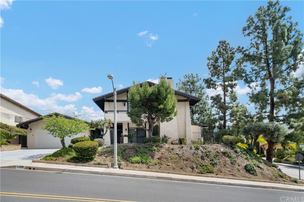 1497 Sunshine Drive Glendale, CA 91208 - Photo 2 of 52 a backyard of a house with a garden and plants