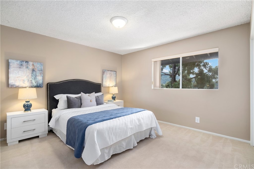 1497 Sunshine Drive Glendale, CA 91208 - Photo 32 of 52 a bedroom with a bed and a painting on the wall