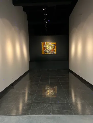 a view of empty room with window and fireplace