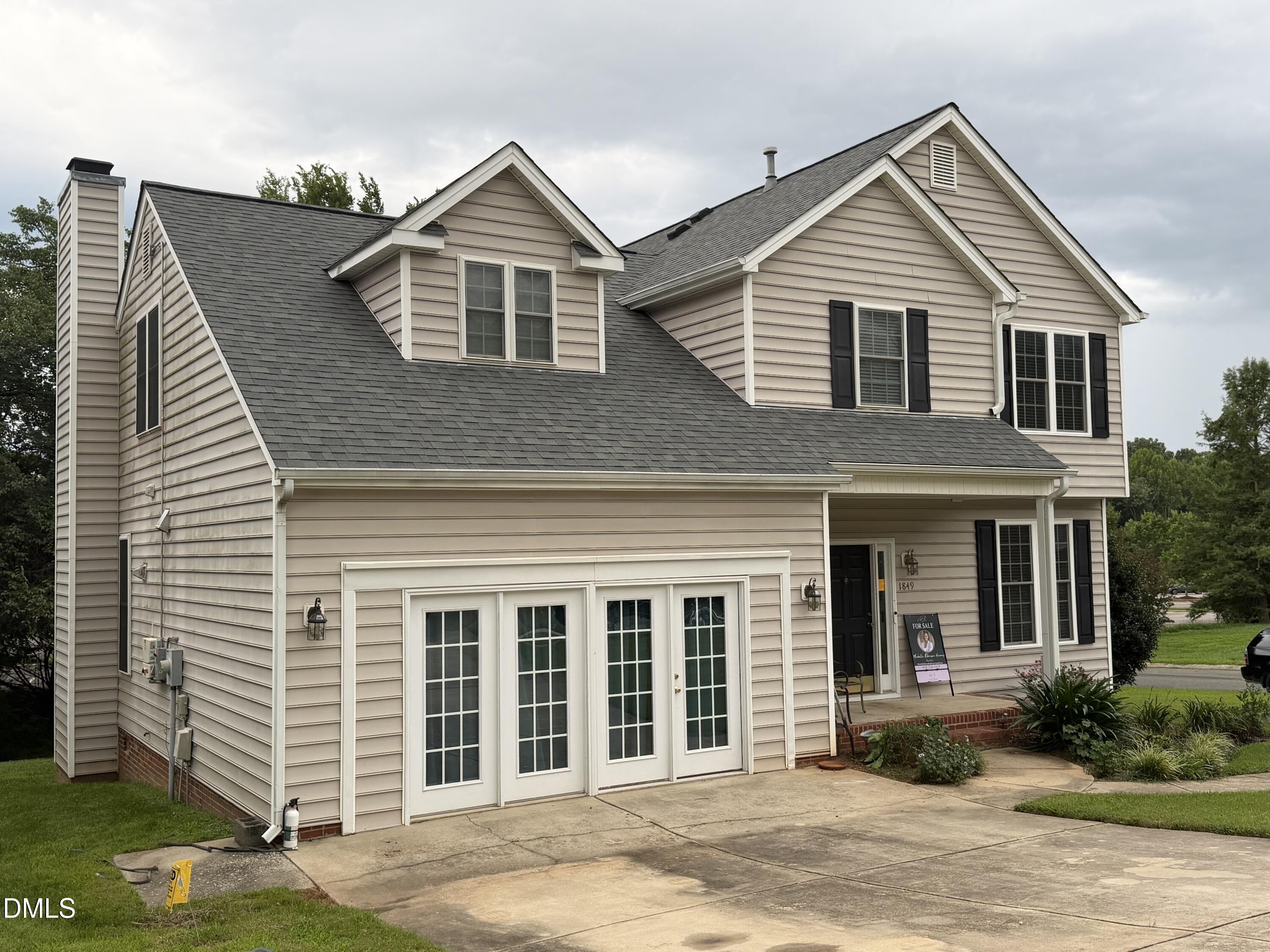 1849 Hanford Hills Road Graham, NC 27253 - Photo 1 of 11 Two-story residence featuring light-colored siding and a dark shingle roof