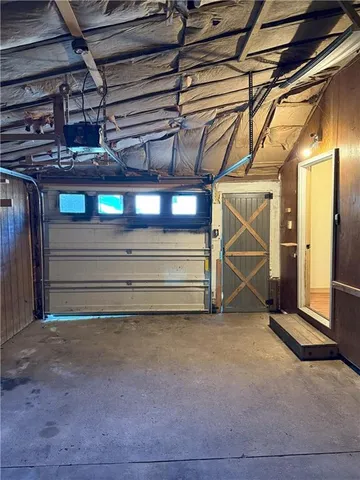 a view of an empty room with wooden walls