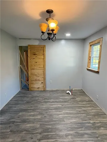 a view of a livingroom with wooden floor