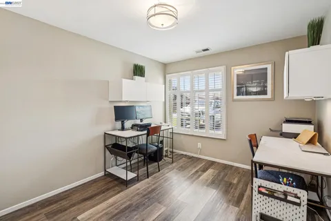 a workspace with furniture hardwood and a window