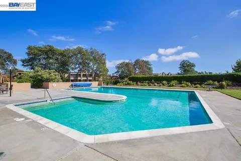 a view of swimming pool with a yard