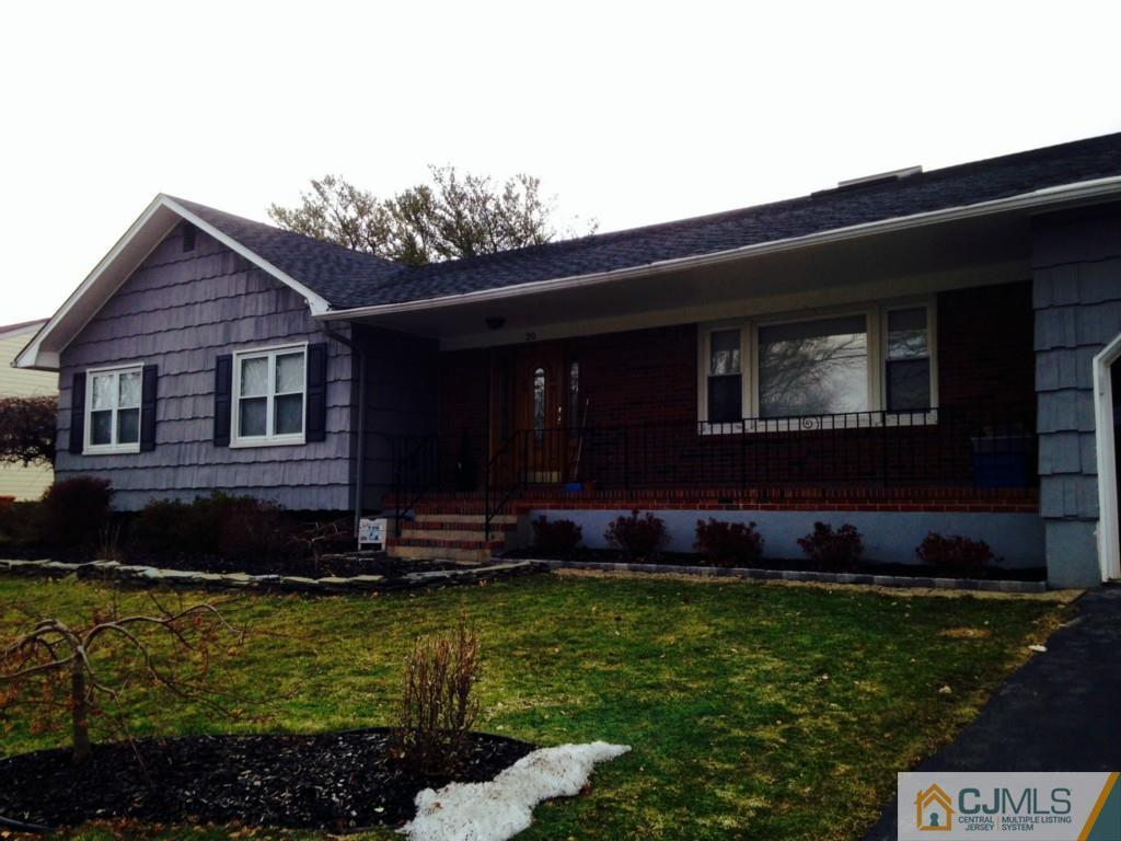 20 Mockingbird Road Edison, NJ 08820 - Photo 1 of 18 a front view of a house with a garden