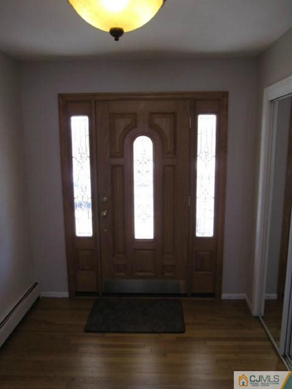20 Mockingbird Road Edison, NJ 08820 - Photo 2 of 18 an empty room with wooden floor and windows