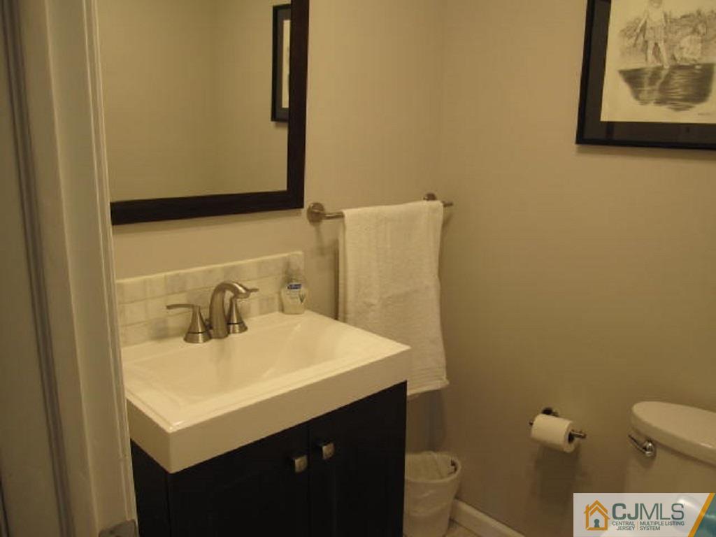 20 Mockingbird Road Edison, NJ 08820 - Photo 11 of 18 a bathroom with a sink and a toilet