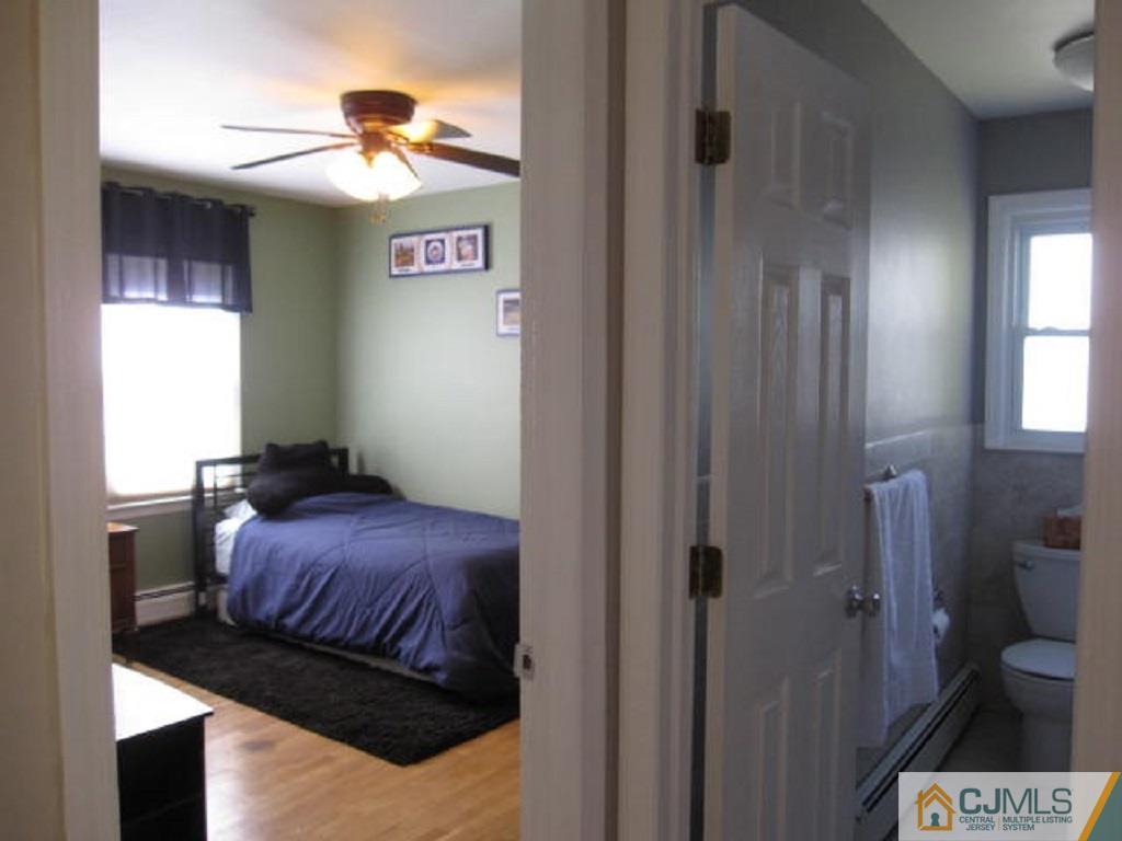 20 Mockingbird Road Edison, NJ 08820 - Photo 13 of 18 a bedroom with a bed and a window