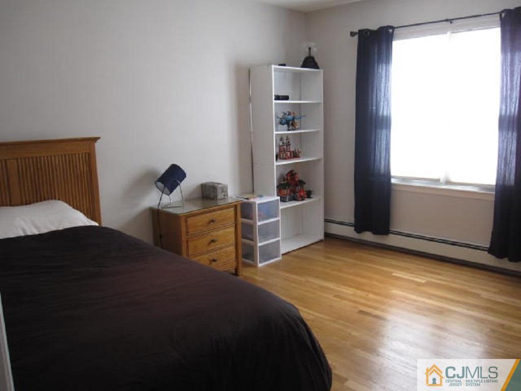20 Mockingbird Road Edison, NJ 08820 - Photo 14 of 18 a bedroom with a bed and a window