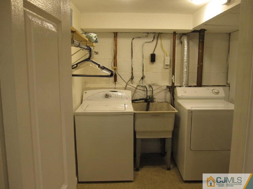 20 Mockingbird Road Edison, NJ 08820 - Photo 18 of 18 a utility room with dryer and washer