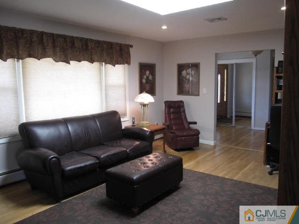 20 Mockingbird Road Edison, NJ 08820 - Photo 6 of 18 a living room with furniture and a large window