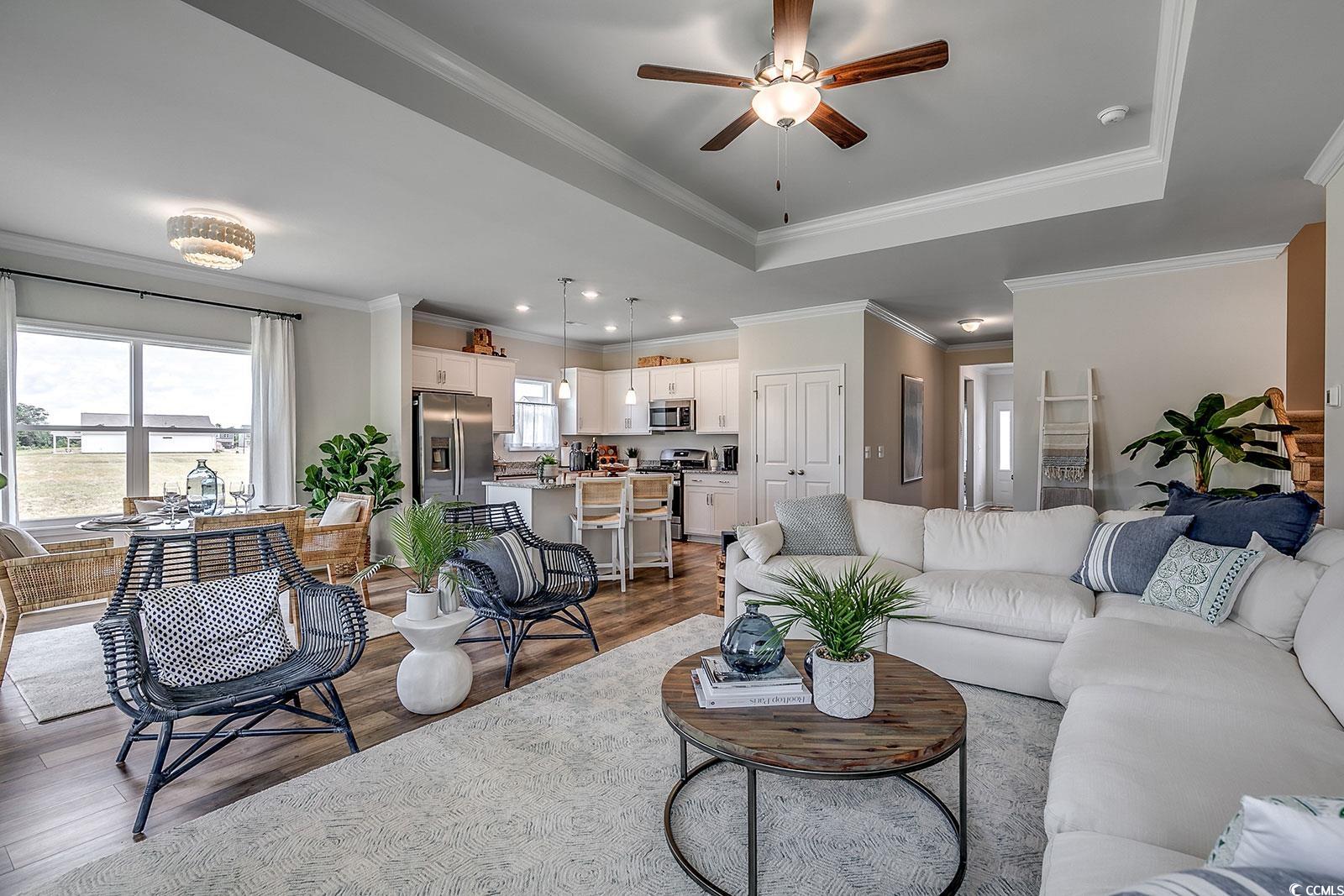327 Dunlin Place Conway, SC 29526 - Photo 7 of 22 Living room with a tray ceiling, ornamental moldin
