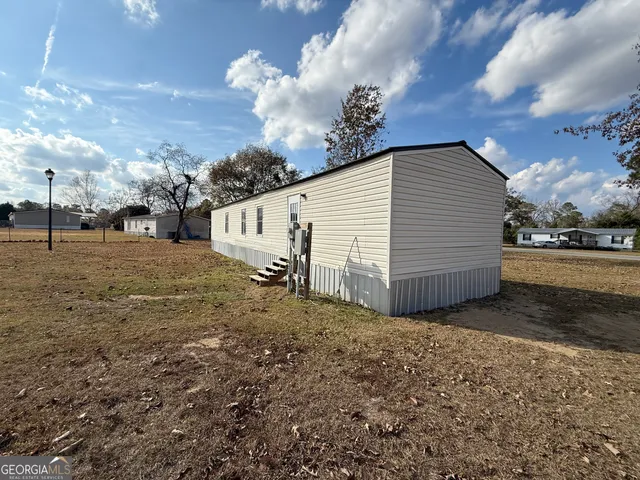 a view of a backyard of the house