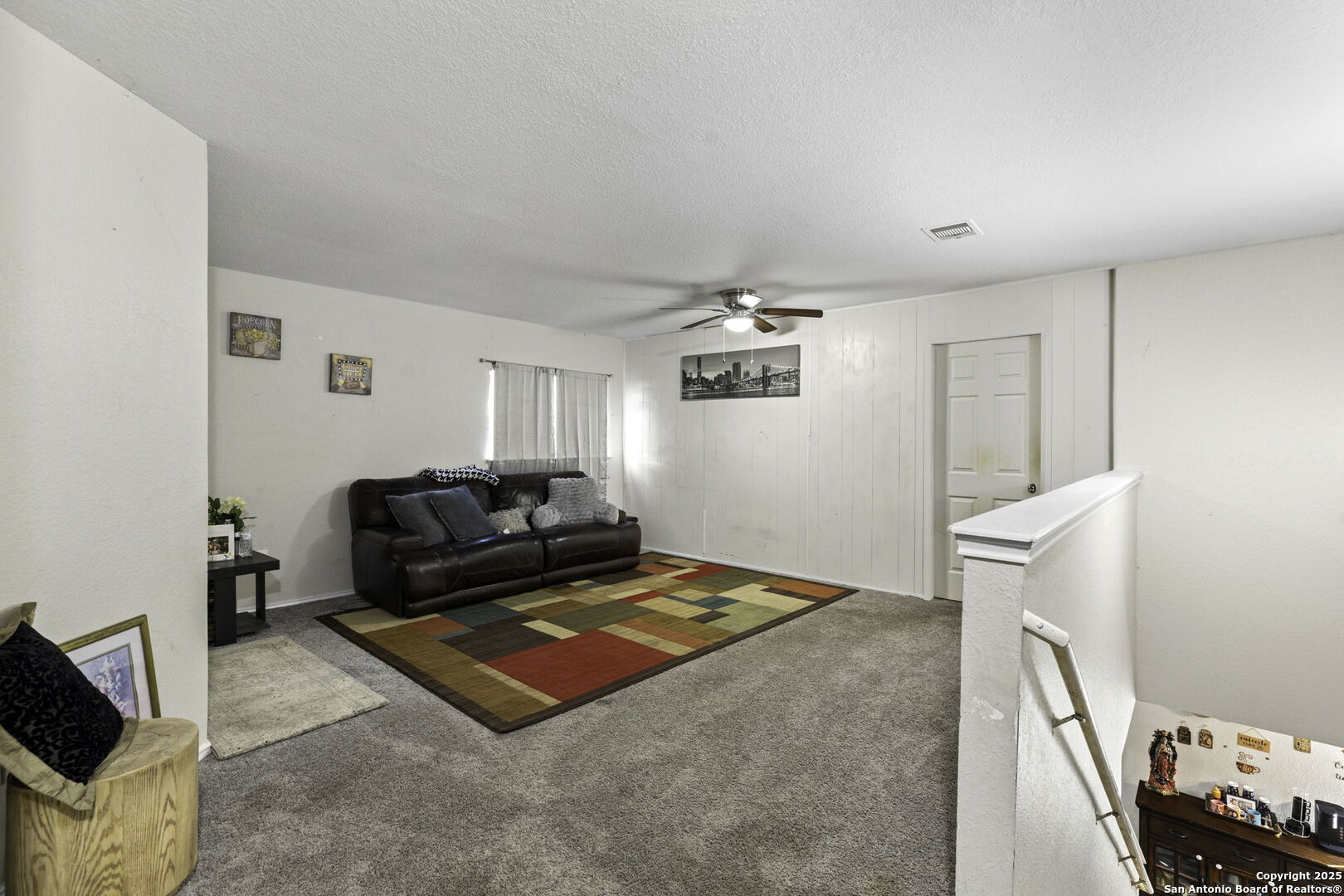 6931 Pecan Converse, TX 78109 - Photo 15 of 25 a living room with furniture and a flat screen tv
