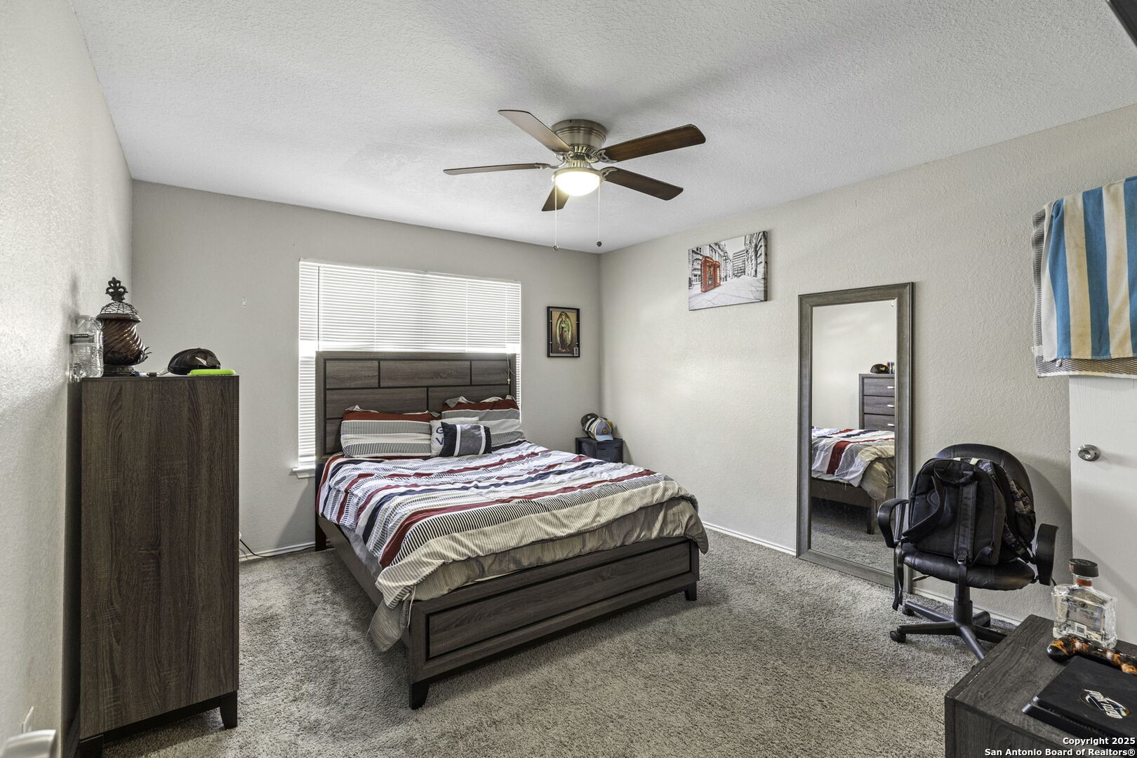 6931 Pecan Converse, TX 78109 - Photo 16 of 25 a bedroom with a bed and a window