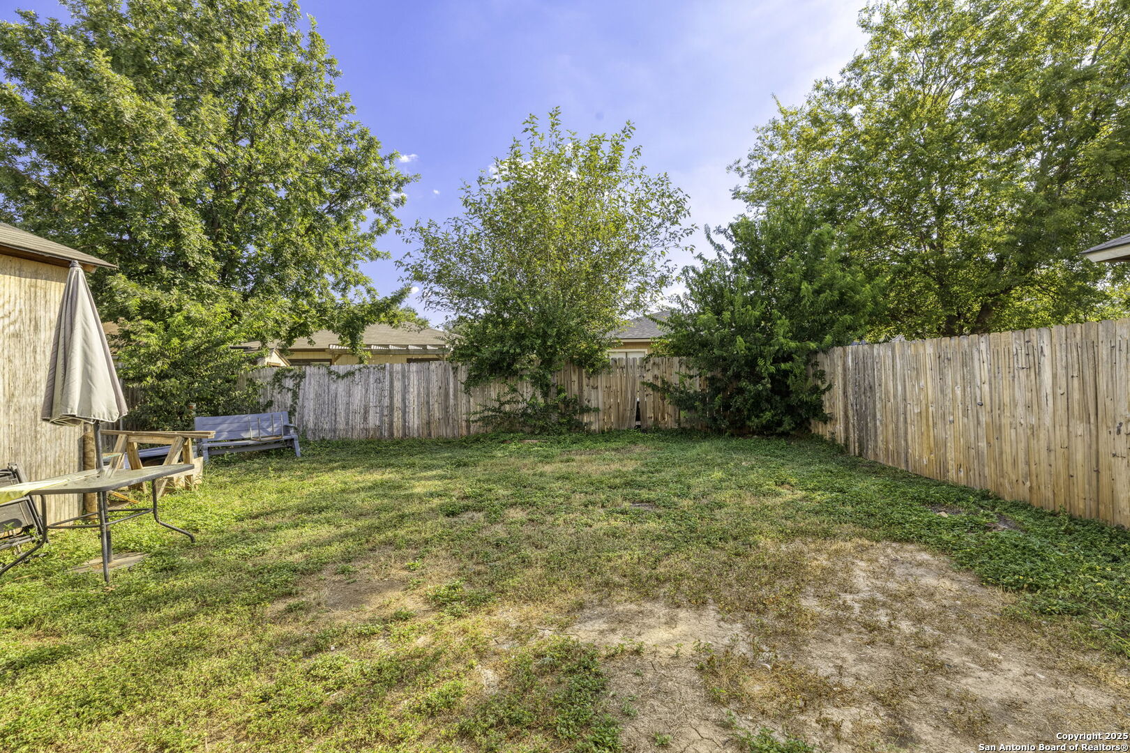 6931 Pecan Converse, TX 78109 - Photo 23 of 25 a backyard of a house with table and chairs