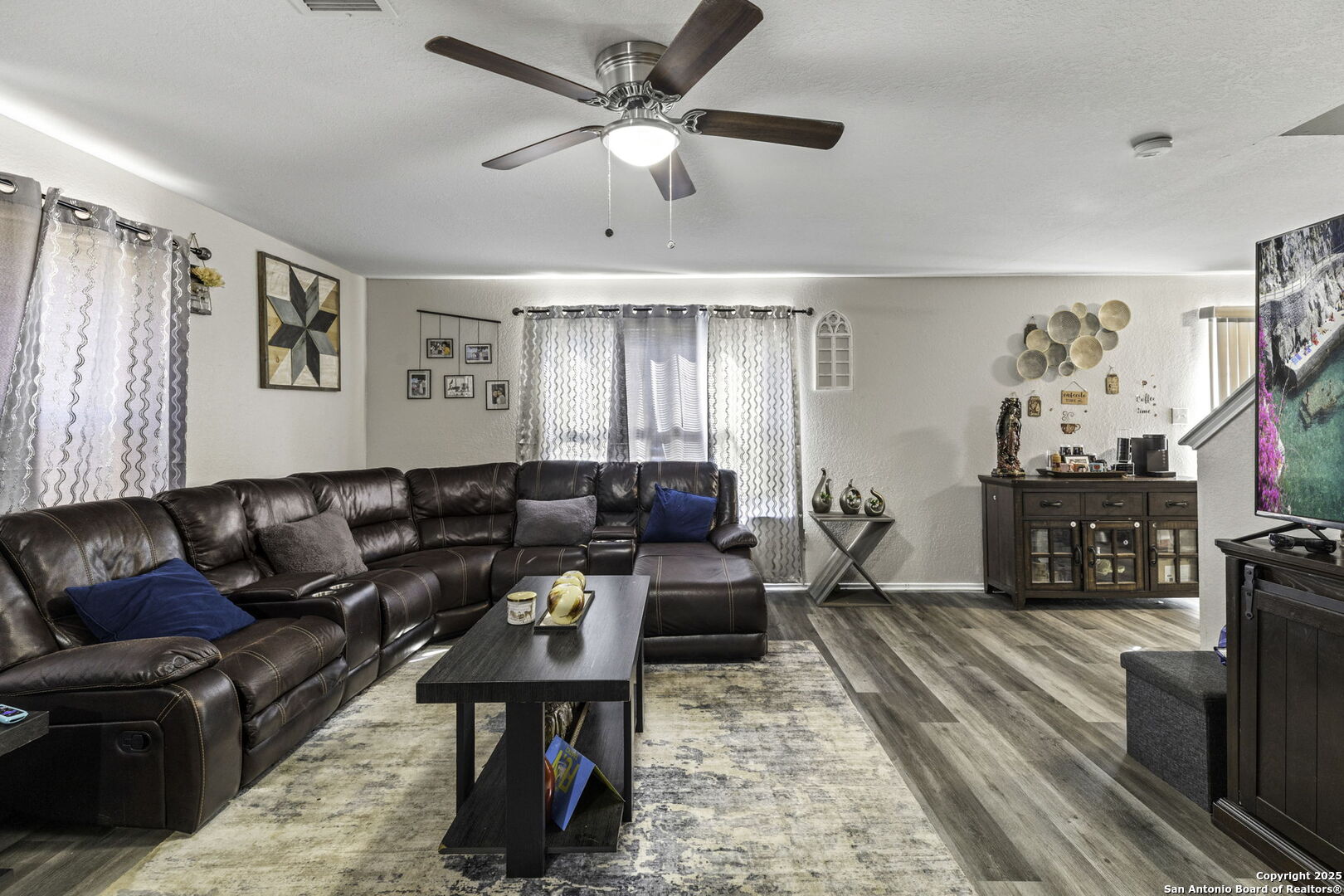 6931 Pecan Converse, TX 78109 - Photo 6 of 25 a living room with furniture ceiling fan and a rug