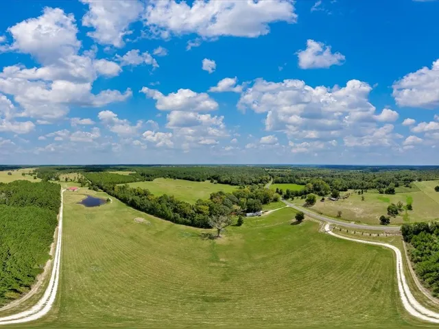a view of a swimming pool in the backyard of a house