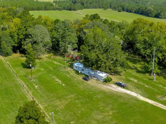 a yard with lots of green space and mountain view