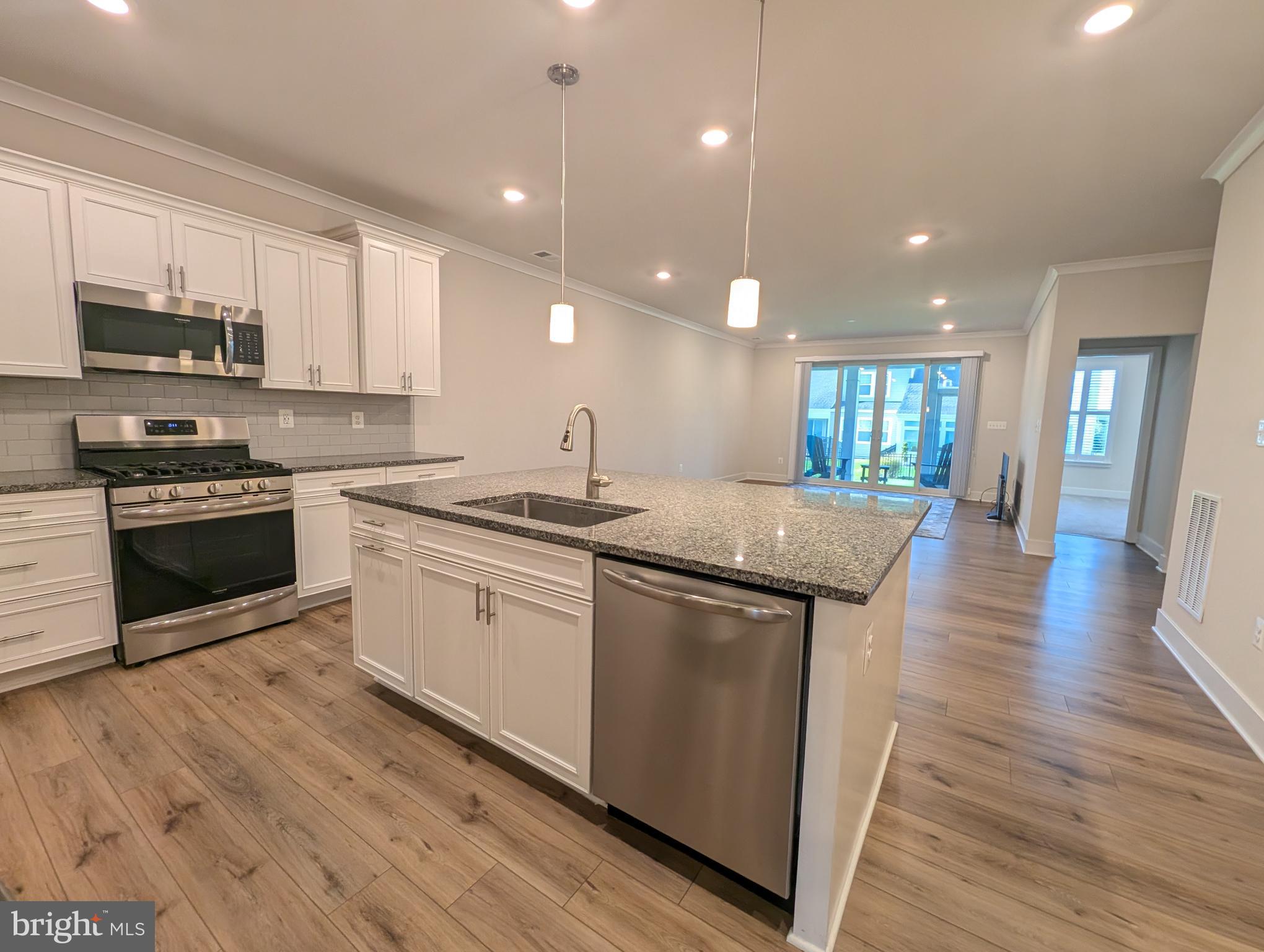 52 Tulip Tree Way Gettysburg, PA 17325 - Photo 6 of 24 a kitchen with stainless steel appliances granite countertop a stove a sink and a refrigerator