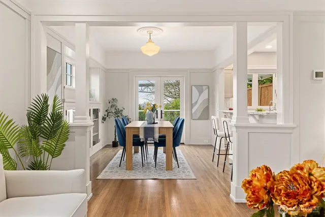 a view of a dining room with furniture and wooden floor