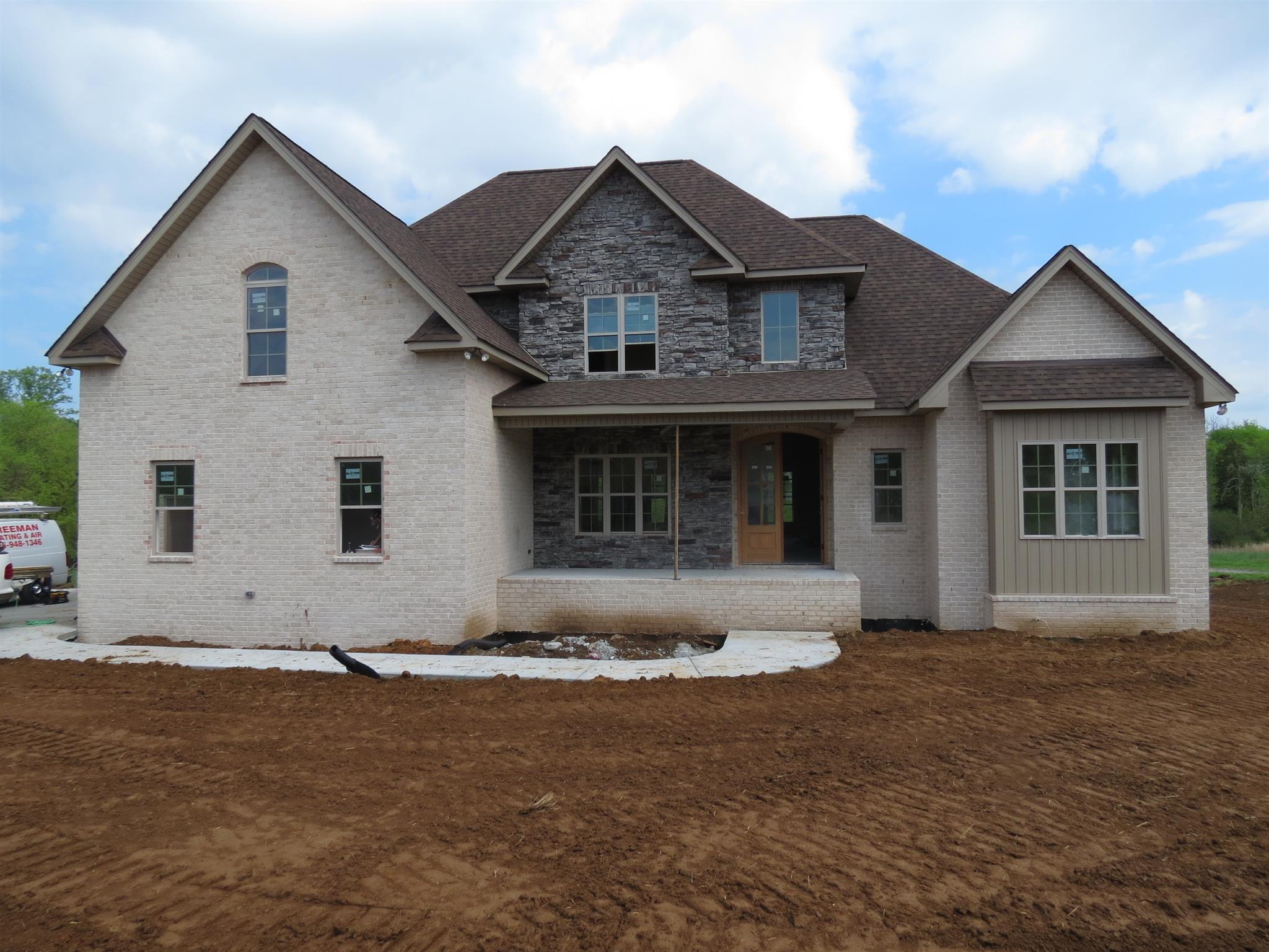 258 Ridgewater Way Mount Juliet, TN 37122 - Photo 2 of 4 a front view of a house with a garden