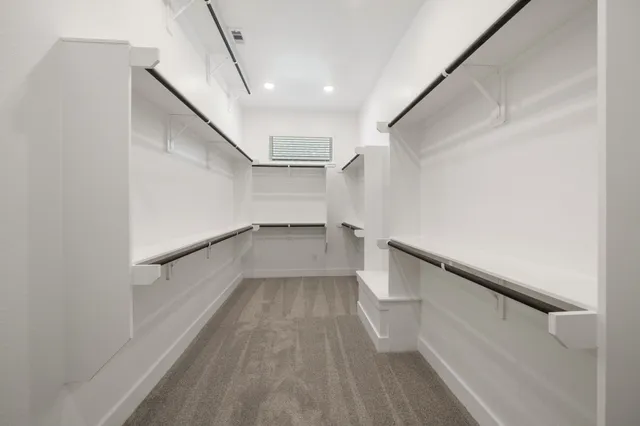 a view of hallway with stairs and wooden floor