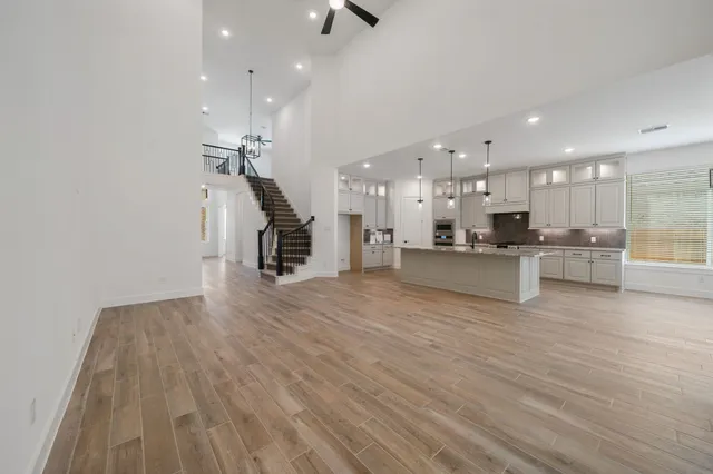 a view of kitchen with cabinets and wooden floor