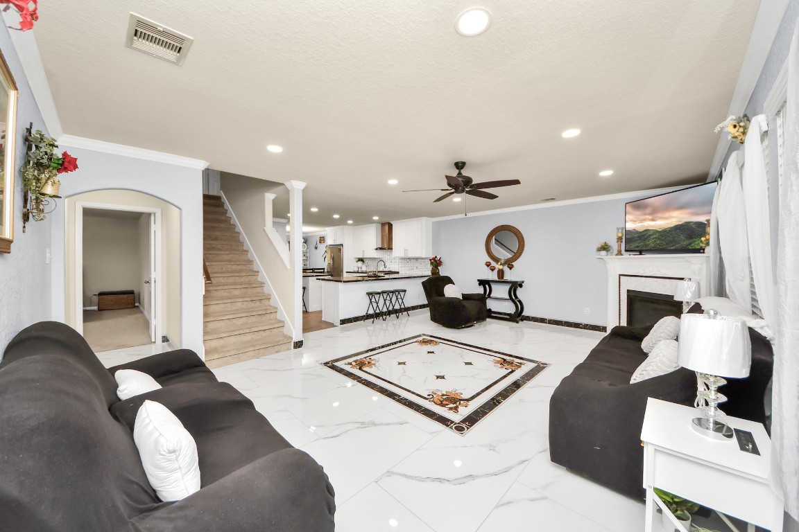 10207 Moonset Lane Houston, TX 77016 - Photo 10 of 34 a living room with furniture and view of kitchen