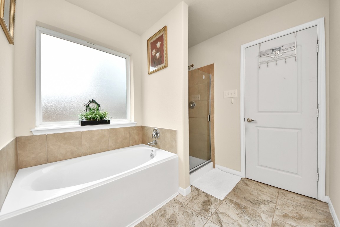 10207 Moonset Lane Houston, TX 77016 - Photo 17 of 34 a white bath tub sitting next to a window