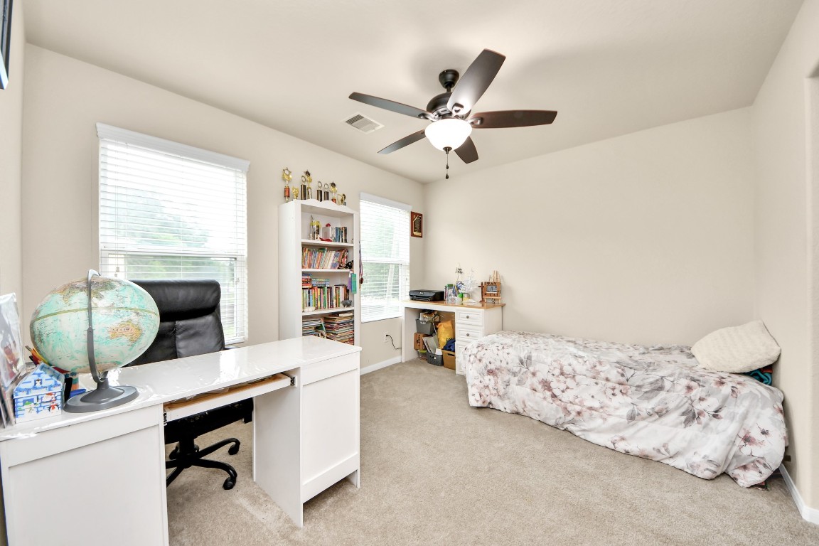 10207 Moonset Lane Houston, TX 77016 - Photo 27 of 34 a bedroom with a bed furniture and a window
