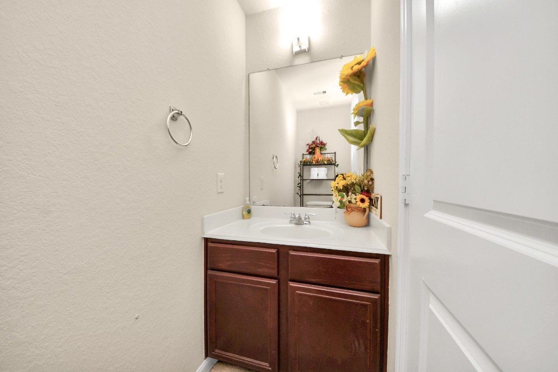 10207 Moonset Lane Houston, TX 77016 - Photo 29 of 34 a bathroom with a sink and a mirror