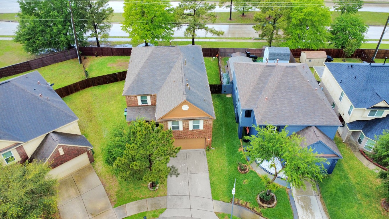 10207 Moonset Lane Houston, TX 77016 - Photo 32 of 34 an aerial view of a house with a garden and trees