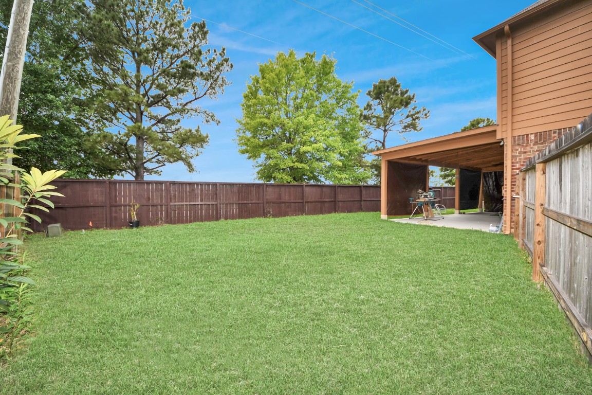 10207 Moonset Lane Houston, TX 77016 - Photo 3 of 34 a front view of a house with garden