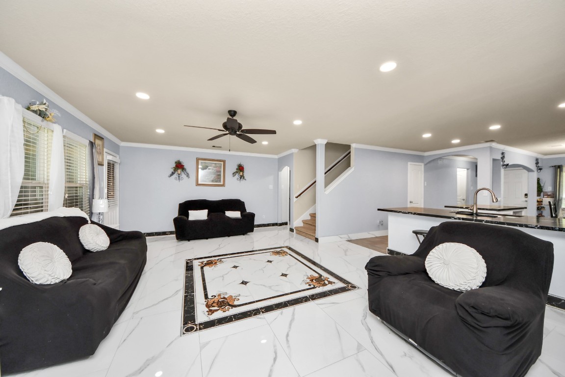 10207 Moonset Lane Houston, TX 77016 - Photo 9 of 34 a living room with furniture and a table