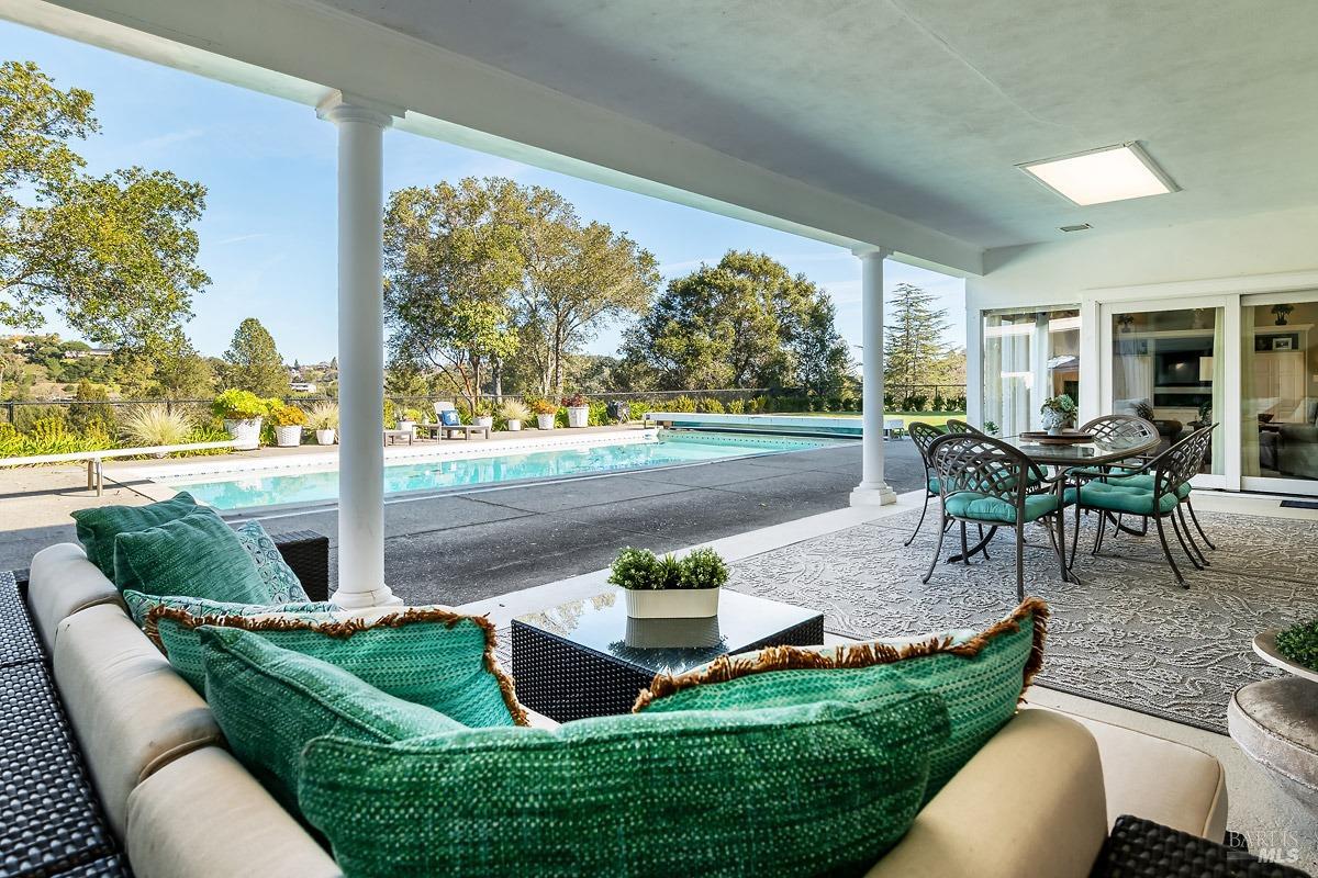 6 Carnoustie Drive Novato, CA 94949 - Photo 1 of 1 a view of a patio with couches chairs and a yard
