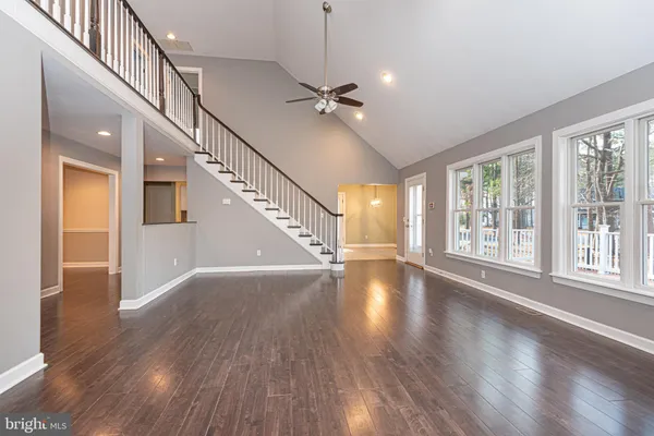 a view of an entryway with wooden floor