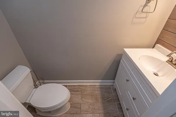 a bathroom with a toilet and a sink