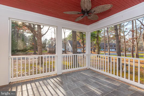 a view of a porch with wooden floor