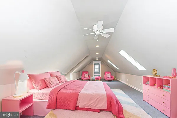 a view of an empty room with wooden floor and window