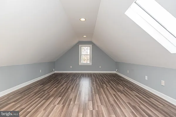 a bed room with a bed and a book shelf
