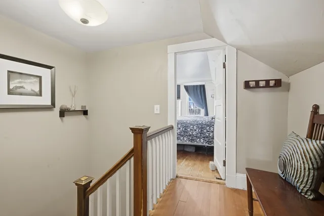 a view of a hallway with entryway and livingroom
