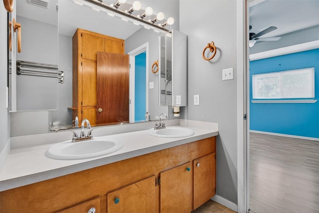 850 Purdue Road Corpus Christi, TX 78418 - Photo 23 of 39 a bathroom with a sink and a mirror