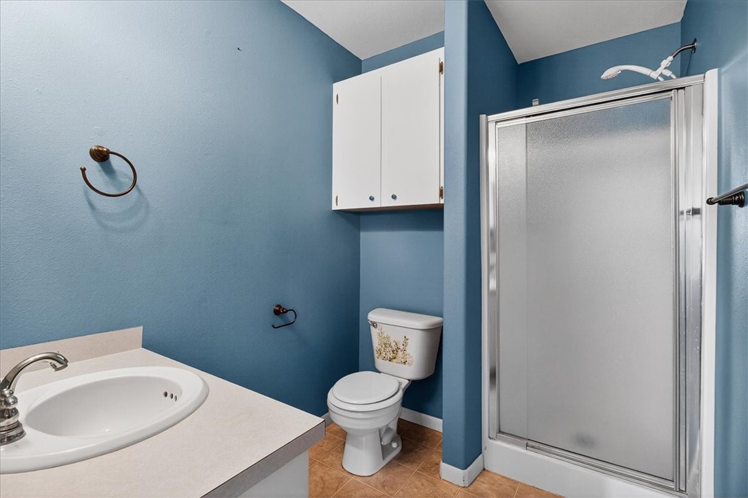 850 Purdue Road Corpus Christi, TX 78418 - Photo 27 of 39 a bathroom with a toilet sink and shower