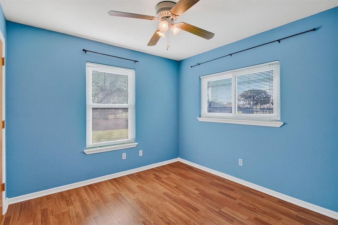 850 Purdue Road Corpus Christi, TX 78418 - Photo 29 of 39 a view of an empty room with window and wooden floor