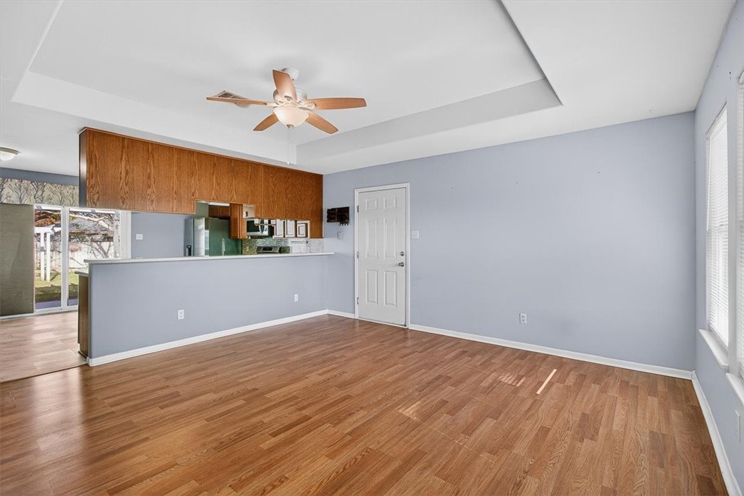 850 Purdue Road Corpus Christi, TX 78418 - Photo 32 of 39 a view of a kitchen with wooden floor and a ceiling fan