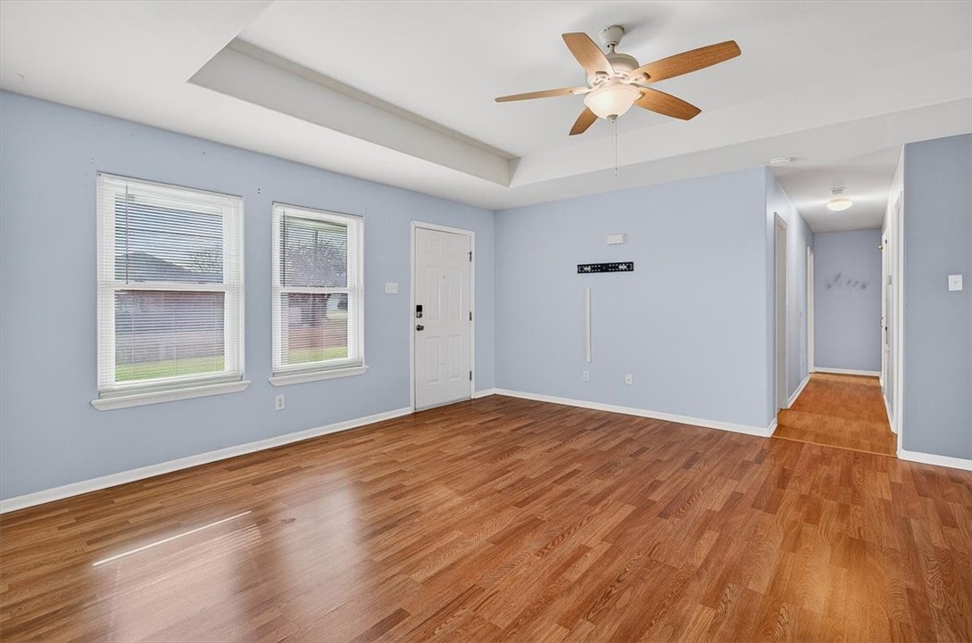 850 Purdue Road Corpus Christi, TX 78418 - Photo 8 of 39 a view of a room with wooden floor and a ceiling fan